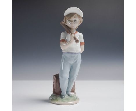 This Lladro Collectors Society figurine, Can I Play?, features a young boy in a baseball cap leaning on a bat, poised with a 