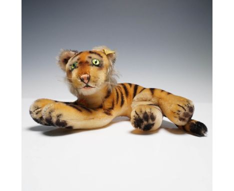 Vintage Steiff plush tiger cat featuring classic mohair fur with airbrushed stripes, green glass eyes, and a felt-lined mouth