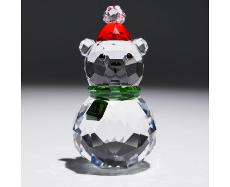 Charming Swarovski crystal figurine titled Rocking Polar Bear, featuring a festive bear in a red Santa hat and green scarf wi