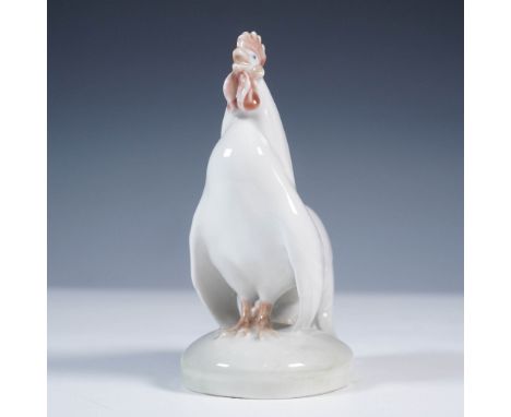 Crafted by the renowned Royal Copenhagen of Denmark, this porcelain figurine captures the noble posture of a standing white r