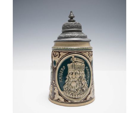 A vintage German beer stein featuring a raised medallion-style portrait of Alexander the Great (Alexander D. Grosse), surroun