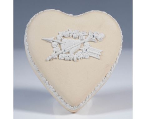 A charming Wedgwood jasperware heart-shaped trinket box and cover in a soft yellow color with white relief decoration. The li
