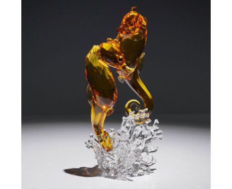 Swarovski crystal figurine from the Crystal Paradise collection, depicting an elegant seahorse couple in vibrant topaz crysta