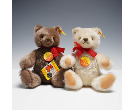 Pair of Steiff Original Teddy Bears, one in ivory and one in brown mohair, each with red ribbon bows, original yellow ear tag