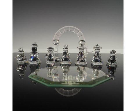 Swarovski crystal nativity scene featuring eight faceted clear crystal figures, including Mary, Joseph, Baby Jesus, the Three