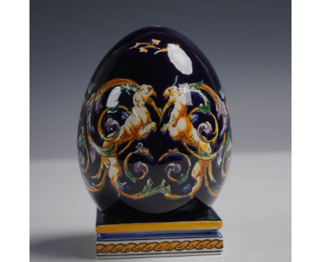 Vibrant two-piece faience egg by Gien France featuring a rich cobalt ground and intricate Renaissance-style decoration with m