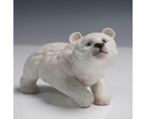 Adorable bisque porcelain figurine of a polar bear cub by Boehm, featuring lifelike texture and expressive detail. Sculpted i