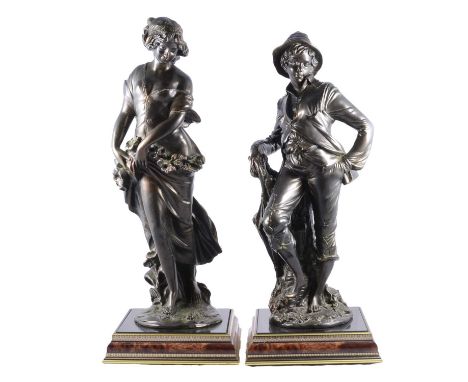 Pair of patinated metal figures, late 20th century, boy with umbrella and a young woman gathering flowers, on square wood-eff