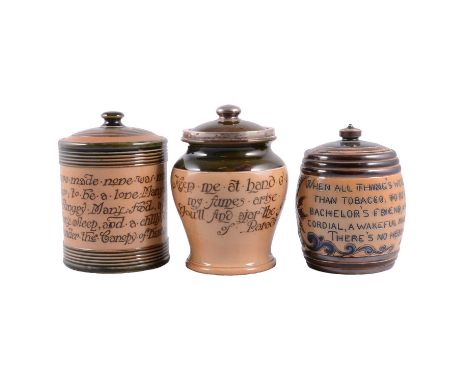 Three Doulton Lambeth stoneware tobacco jars: one with silver rim and finial, all three with verse related to tobacco 'Keep m