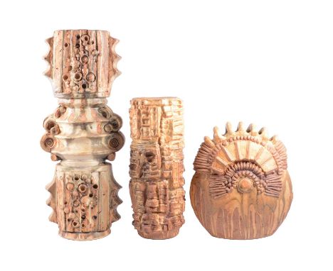 Three Bernard Rooke Pottery vessels, two of Totem form, heavily modelled with tan and buff glazes, 51cm and 34cm; the third o
