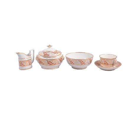English hybrid hard paste porcelain tea and dessert, decorated in iron red and gilt, perhaps Coalport.