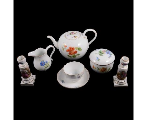 Meissen tea service, painted with flowers, comprising two teapots, jug, sucirer and cover, seven cups, nine saucers (all fact
