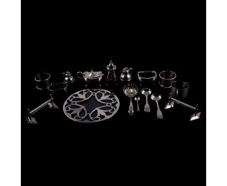 Pair of silver knife rests, William Hutton &amp; Son, London 1898, silver condiments, four silver napkin rings, etc., total w