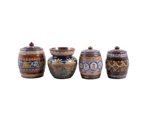 Four Doulton Lambeth stoneware tobacco jars: all one with moulded panelling with Gothic lettering 'Tobacco', 14cm; one with b
