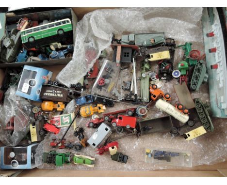A box containing 00 scale vehicles and accessories