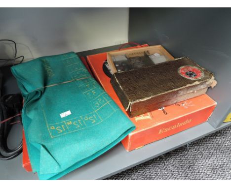 Four vintage games, Chad Valley Escalado, Janneau Indoor Boules Set, Banda Capet Bowls set and a Roulette Wheel and cloth