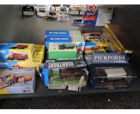 A shelf of modern Corgi diecasts including On The Move, Chipperfield, Pickfords etc, all boxed approx 16