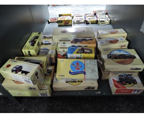 A shelf of Corgi Classics and similar diecast Adverting Vans, Buses, Construction Vehicles etc, all boxed (28)