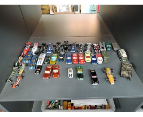 A shelf of mainly Corgi playworn diecasts including Racing Cars, Military, Saloons, etc also a Schuco Micro Racer Ferrari