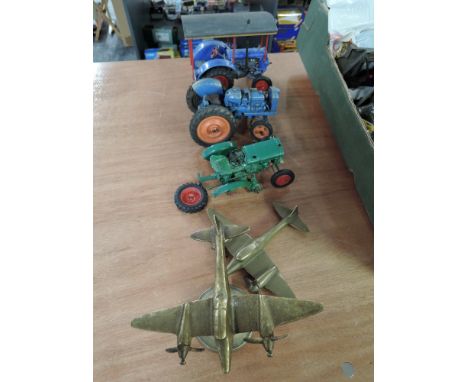 A Chad Valley diecast and two similar plastic vintage Tractors and two brass WWII Fighter Planes