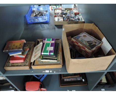 A shelf of vintage puzzles and card games including Richter's Anchor Box Building Stone set in three colours, a similar The S