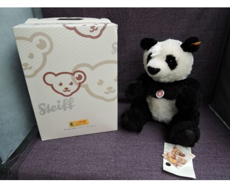 A modern Steiff Panda 060144 with yellow tag and button, boxed,
