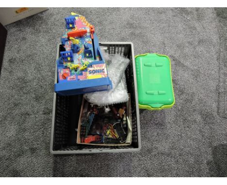 A box of mixed toys including playworn diecasts, Sonic Pinball game and vintage Marbles