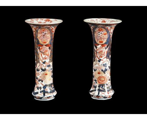 A pair of Japanese Imari trumpet vases, the tapering cylindrical bodies painted with birds and flowers, 39.5cm high (2) Condi