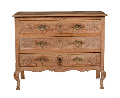 A French oak commode in Louis XVI style, 19th century, with carved shell and bell flower motifs, 84cm high, 105cm wide, 49cm 