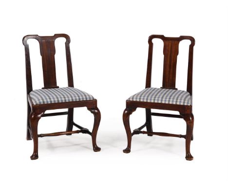 A pair of George II side chairs, circa 1740, each low back above a blue and white drop in seat, 89cm highCondition Report: Ma
