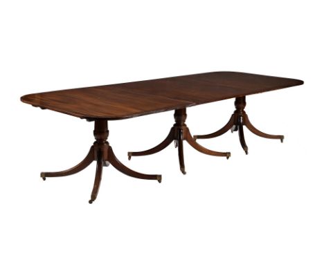 A mahogany three-pillar dinning table in George III style, late 20th century, with two additional leaf insertions, 75cm high,