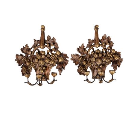 A pair of carved and giltwood three light wall appliques in 18th century taste, 20th century, the backplates modelled as bask