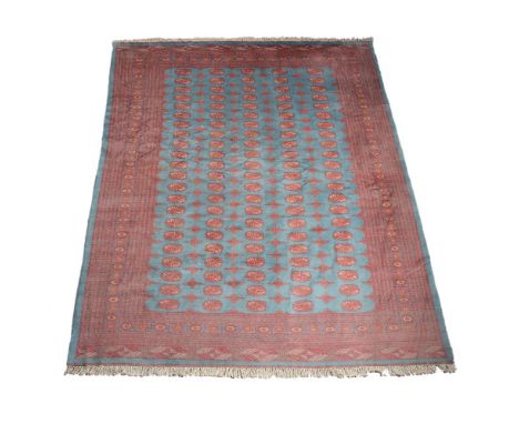 A modern Bokhara style carpet, approximately 296 x 221cm, together with an blue and pink carpet in Bokhara style, approximate