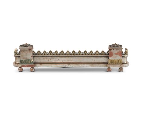 A steel and brass mounted fender in Regency taste, late 19th/early 20th century, with Lotus leaf ornament and raised on ball 
