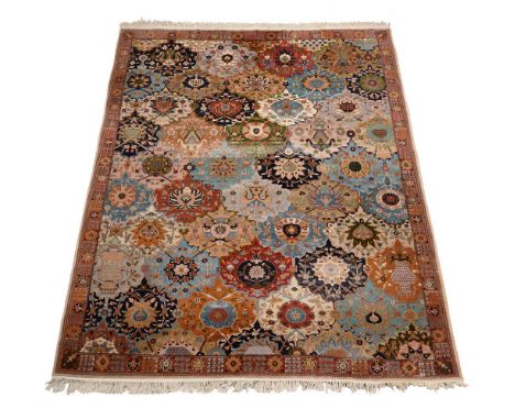A Tabriz carpet approximately 296 x 213cm Condition Report: Some wear to pile overall, with some areas of additional wear in 