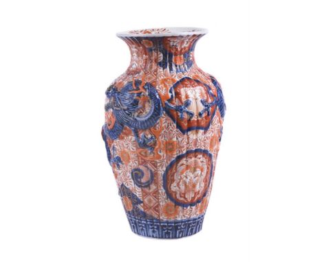 An Imari vase, early 20th century, of gadrooned and shouldered form and modelled in relief with dragons, 37.5cm highCondition