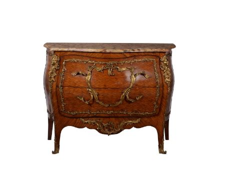 A French parquetry and gilt metal mounted bombe commode in Louis XV style, with marble top above two drawers, 93cm high, 123c