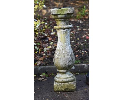 A carved limestone baluster plinth, late 19th or early 20th century, with later sundial applied, the dial with poetic inscrip