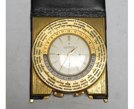 A vintage Luxor Swiss gold plated world time quartz travel alarm clock, in black leather case. Condition - fair to good