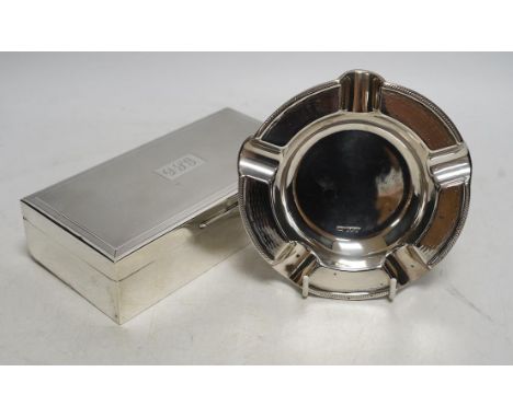 A 1960's engine-turned silver mounted rectangular cigarette box, 17.8cm and a silver ashtray. Condition - fair