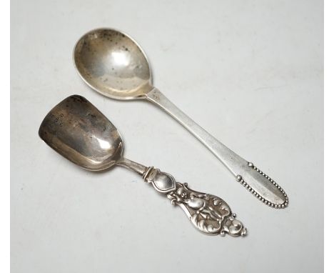 A George IV silver caddy spoon, Taylor &amp; Perry, Birmingham, 1829, 11.4cm, together with a George V silver Georg Jensen sp