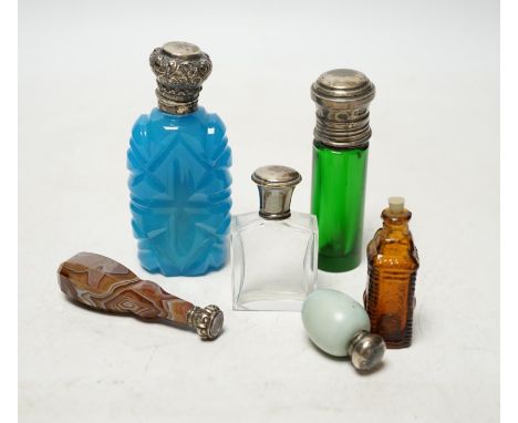 Five assorted mounted scent bottles including glass and ceramic egg shape, largest 94mm, together with a Victorian banded aga