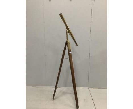 A late 19th century brass two draw telescope, by J. H. Steward, on oak tripod stand, 56cm. Condition - fair, some parts seize