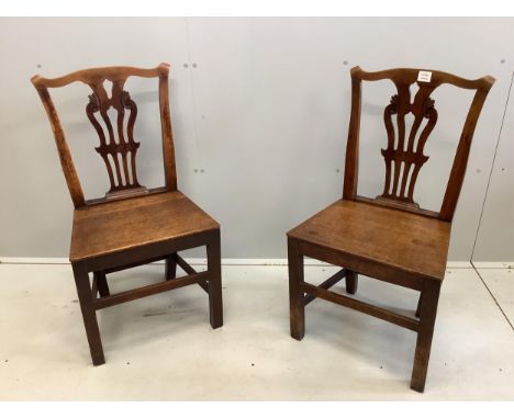 A pair of Chippendale style mahogany dining chairs, height 91cm. Condition - fair