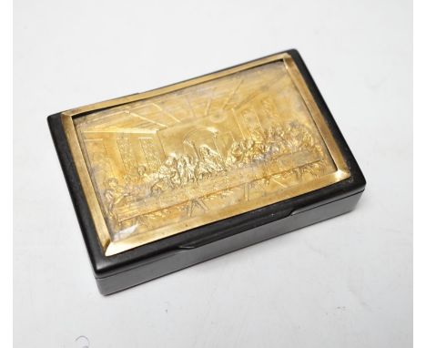 A 19th century ebonised rectangular snuff box, with inset yellow metal lid, with scene depicting The Last Supper after Da Vin