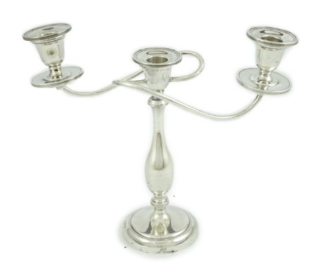 A George VI silver two branch, three light candelabrum, by William Adams Ltd, Birmingham, 1937, height 24cm, 13.7oz. Conditio