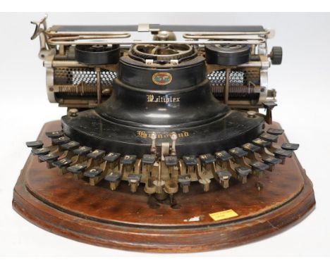 A scarce early 20th century Hammond Multiplex typewriter, with convex keyboard in an oak plywood case, case 20cm high, 35cm w