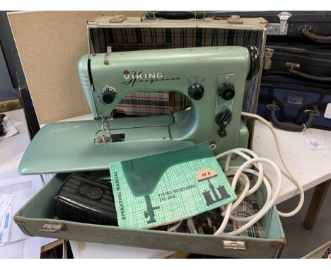 A Swedish 1950s/60s Viking Husqvarna Zig-Zag electric sewing machine, in original fitted case with instruction manual. Condit