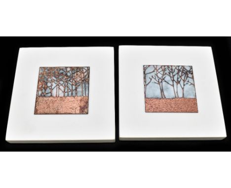 JANINE PARTINGTON; two contemporary enamel plaques each decorated with trees in landscape scenes, mounted on painted wooden b