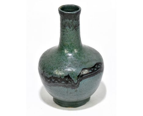 CARTER &amp; COMPANY: a Poole Art Pottery bottle vase with stylised decoration on a green glaze, impressed mark to the unders